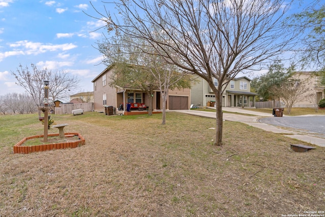 view of front of home featuring a garage, covered porch, and a front lawn