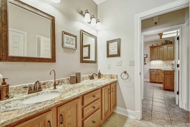 bathroom with tasteful backsplash, vanity, and tile patterned flooring