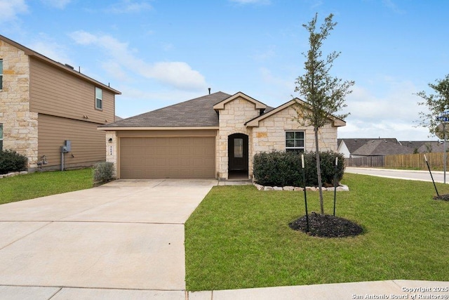 view of front of house with a garage and a front yard