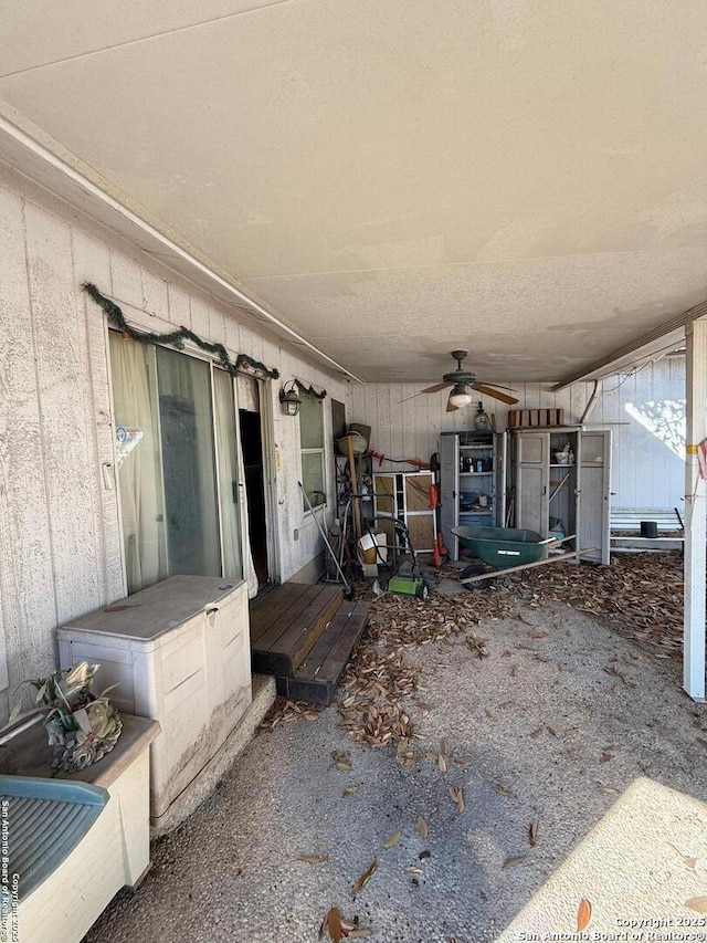 view of patio featuring ceiling fan