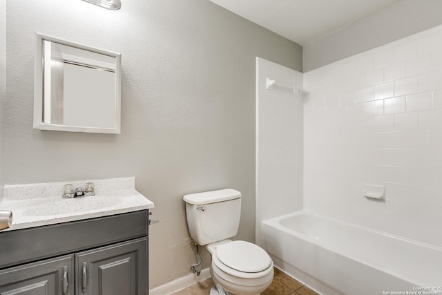 full bathroom with tile patterned floors, toilet, tub / shower combination, and vanity