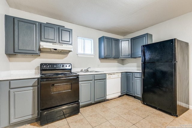 kitchen featuring sink, black appliances, a textured ceiling, and light tile patterned flooring