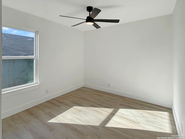 unfurnished room featuring ceiling fan and light hardwood / wood-style flooring