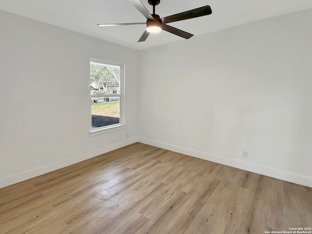 spare room with ceiling fan and light hardwood / wood-style flooring