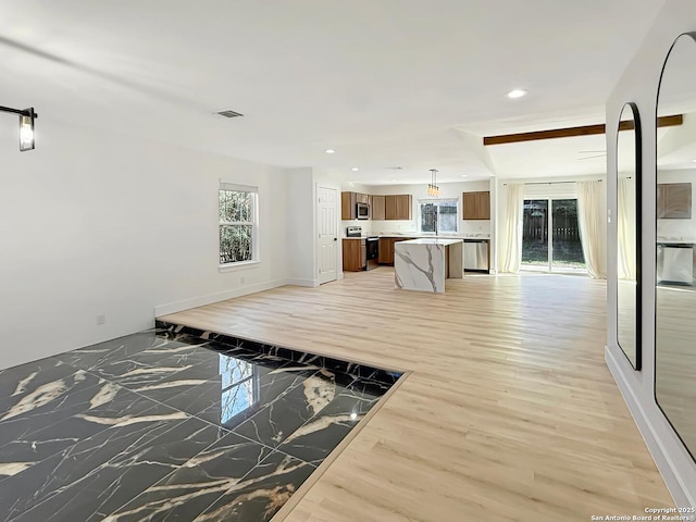 unfurnished living room featuring hardwood / wood-style floors