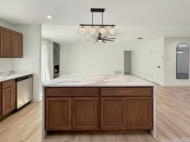 kitchen with dishwasher, pendant lighting, ceiling fan, and light hardwood / wood-style floors