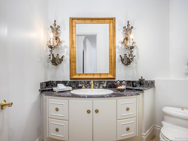 bathroom with vanity and toilet