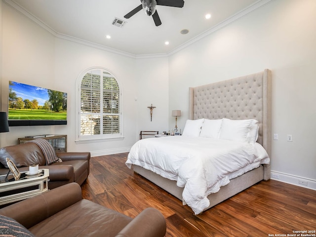 bedroom featuring ornamental molding, dark hardwood / wood-style floors, and ceiling fan