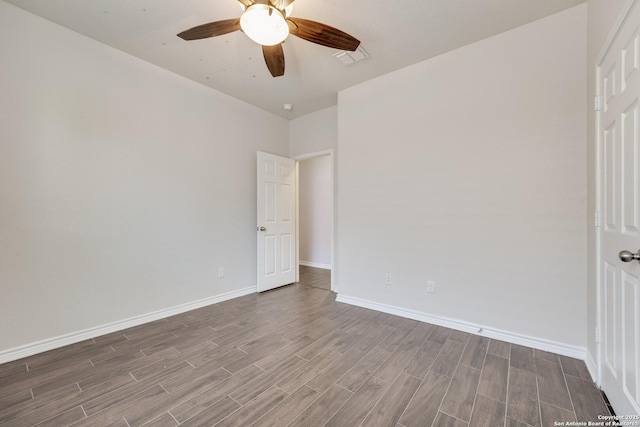 unfurnished room with ceiling fan