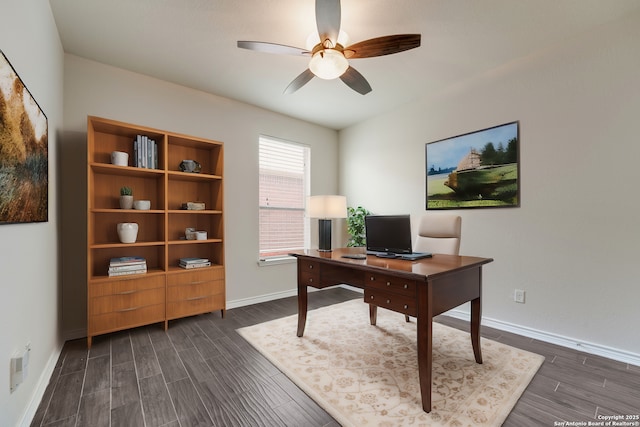 home office with dark wood-type flooring and ceiling fan