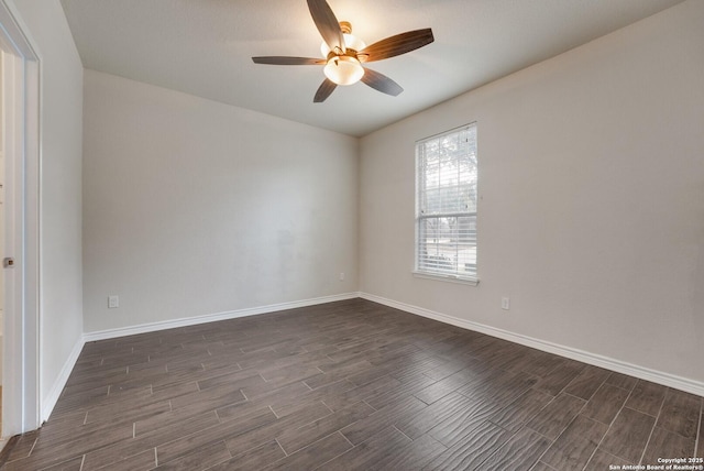 spare room with ceiling fan and dark hardwood / wood-style floors