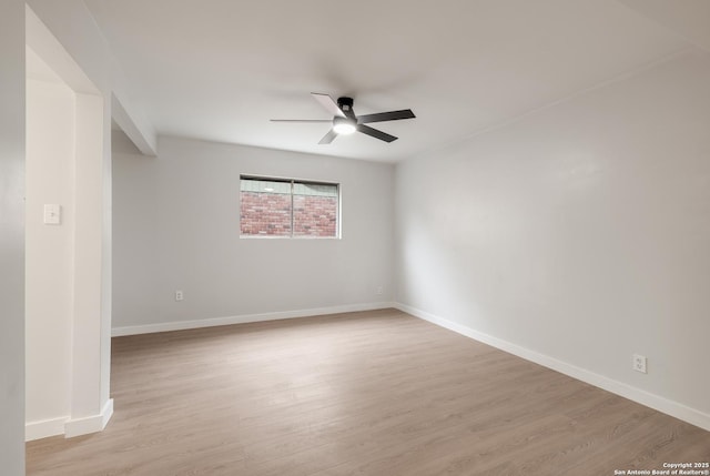 unfurnished room featuring ceiling fan and light wood-type flooring