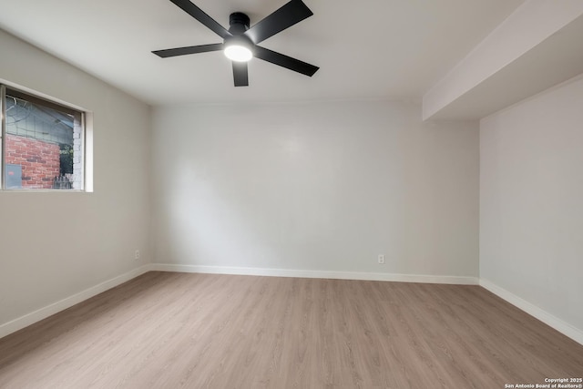 spare room featuring ceiling fan and light hardwood / wood-style floors