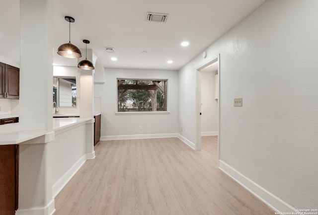 empty room with light wood-type flooring