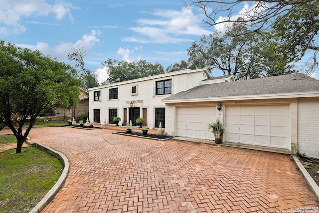 view of front of property with a garage