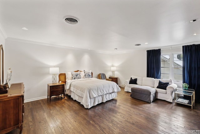 bedroom featuring dark wood-type flooring and ornamental molding