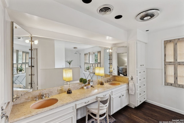 bathroom with vanity and hardwood / wood-style floors