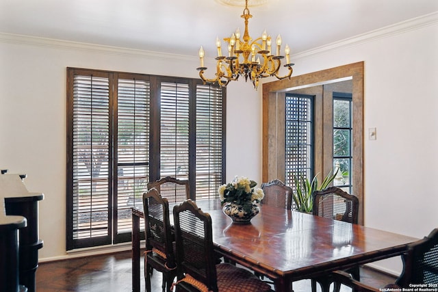 dining area featuring crown molding, dark parquet floors, and a chandelier