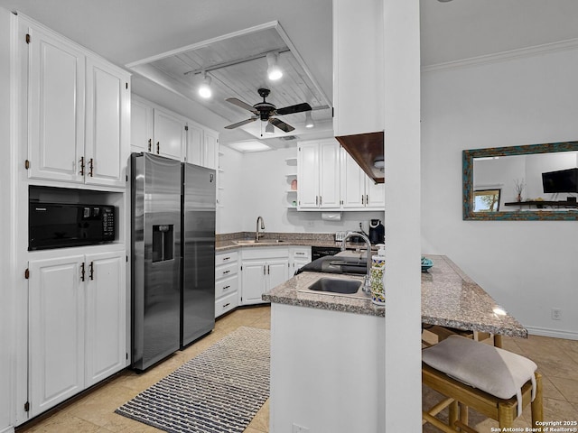 1048 Parkview Dr, Canyon Lake, TX 78133 - kitchen featuring white cabinetry, sink, and stainless steel fridge with ice dispenser