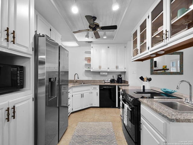1048 Parkview Dr, Canyon Lake, TX 78133 - kitchen with a raised ceiling, sink, white cabinets, and black appliances