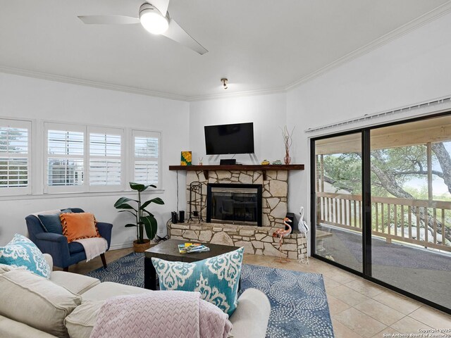 1048 Parkview Dr, Canyon Lake, TX 78133 - tiled living room featuring ceiling fan, ornamental molding, and a stone fireplace