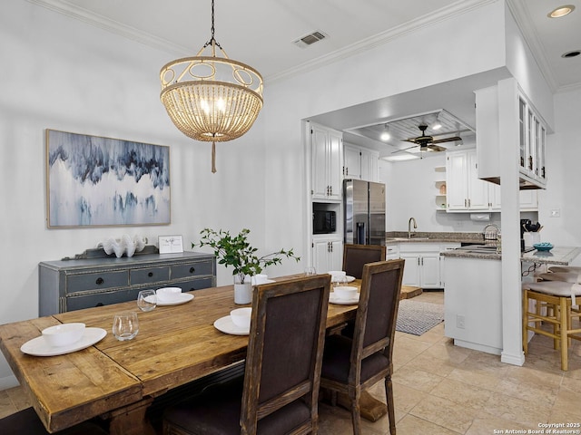 1048 Parkview Dr, Canyon Lake, TX 78133 - dining area featuring ornamental molding, sink, and ceiling fan with notable chandelier
