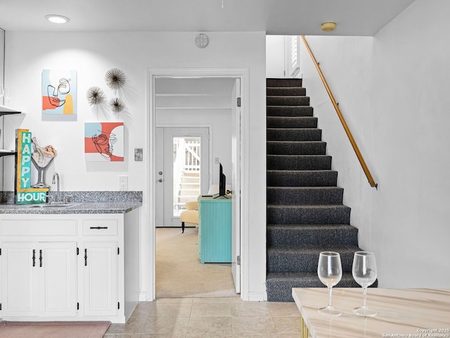 1048 Parkview Dr, Canyon Lake, TX 78133 - staircase featuring sink and carpet flooring