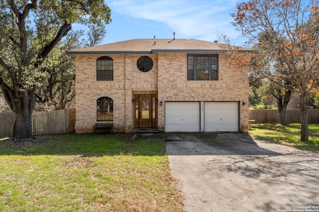 view of front of home featuring a garage and a front yard