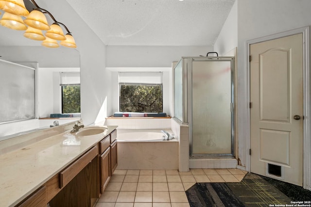 bathroom with tile patterned flooring, vanity, separate shower and tub, a textured ceiling, and an inviting chandelier