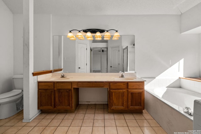 full bathroom featuring vanity, a textured ceiling, tile patterned floors, and separate shower and tub