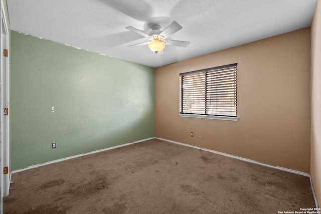 unfurnished room with ceiling fan, a textured ceiling, and carpet