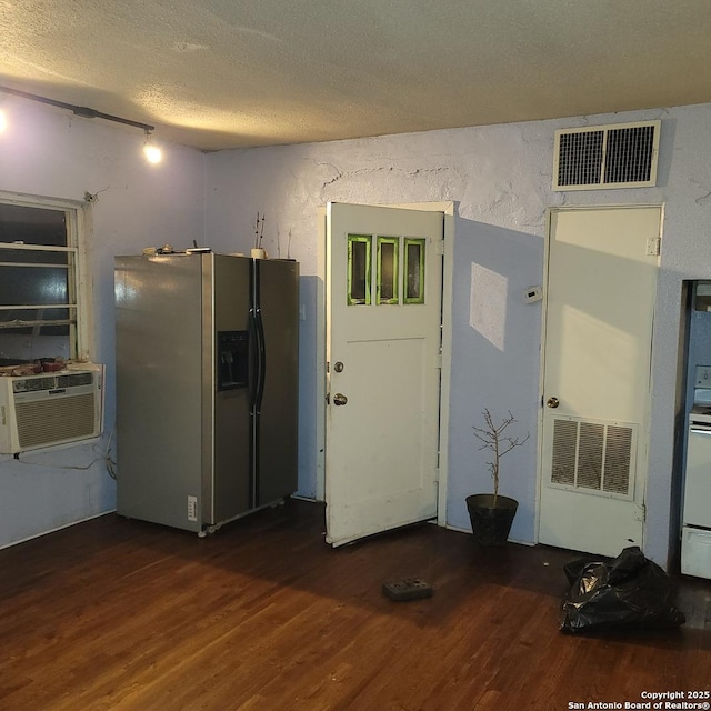 kitchen with dark wood-type flooring, cooling unit, a textured ceiling, and stainless steel fridge with ice dispenser