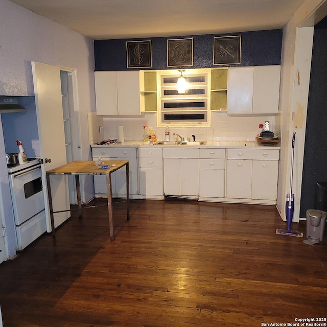 kitchen with white range with electric cooktop, white cabinetry, ventilation hood, dark hardwood / wood-style flooring, and decorative backsplash