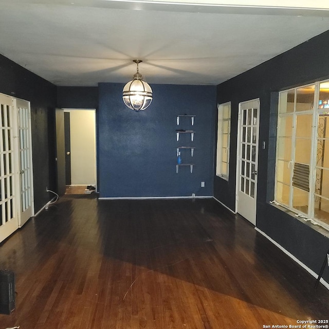 unfurnished room featuring dark wood-type flooring