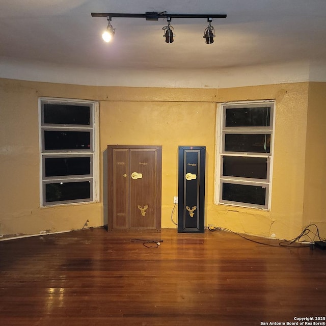 unfurnished living room featuring dark hardwood / wood-style flooring