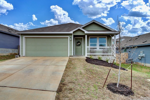 view of front facade with a garage, a front yard, and a porch