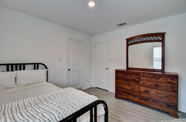 bedroom with light wood-type flooring