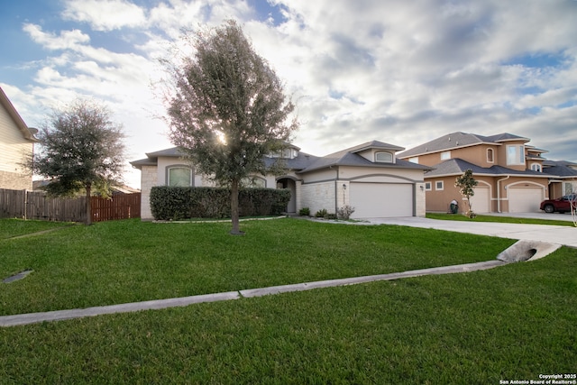 view of front of property with a garage and a front lawn