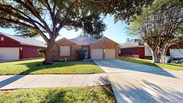 single story home featuring a garage and a front lawn