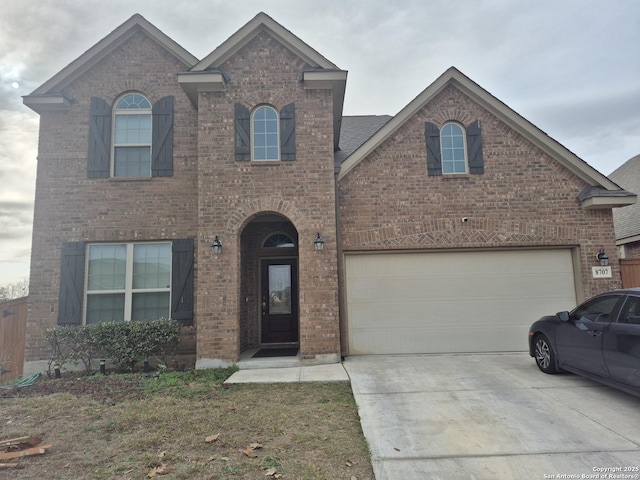 view of front of property featuring concrete driveway and brick siding