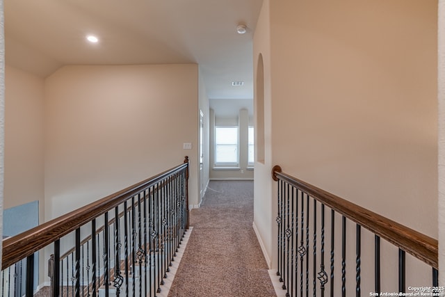 corridor with recessed lighting, carpet flooring, visible vents, and baseboards