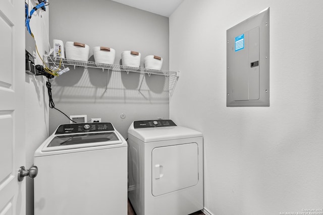 washroom with electric panel and washing machine and dryer