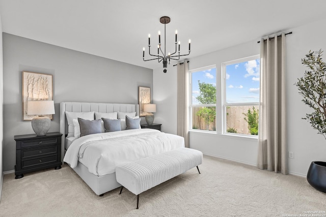 carpeted bedroom with an inviting chandelier