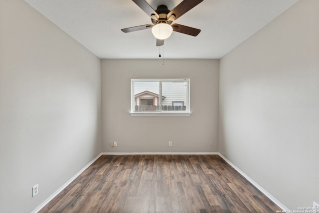 unfurnished room with ceiling fan and dark hardwood / wood-style floors