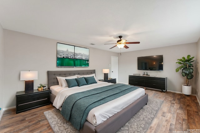 bedroom with hardwood / wood-style flooring and ceiling fan