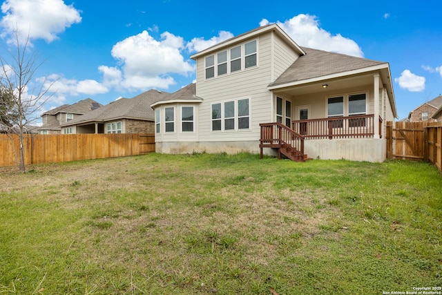 back of house with a yard