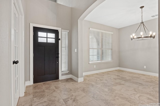 foyer with a notable chandelier