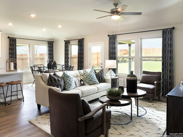 living room with plenty of natural light, recessed lighting, light wood-type flooring, and ceiling fan