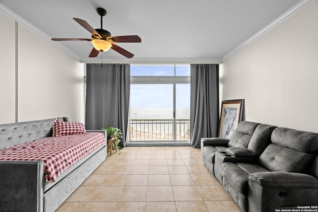 living room with crown molding, ceiling fan, expansive windows, and light tile patterned flooring