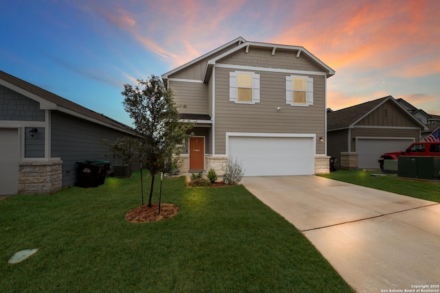 craftsman house with central AC, a yard, and a garage